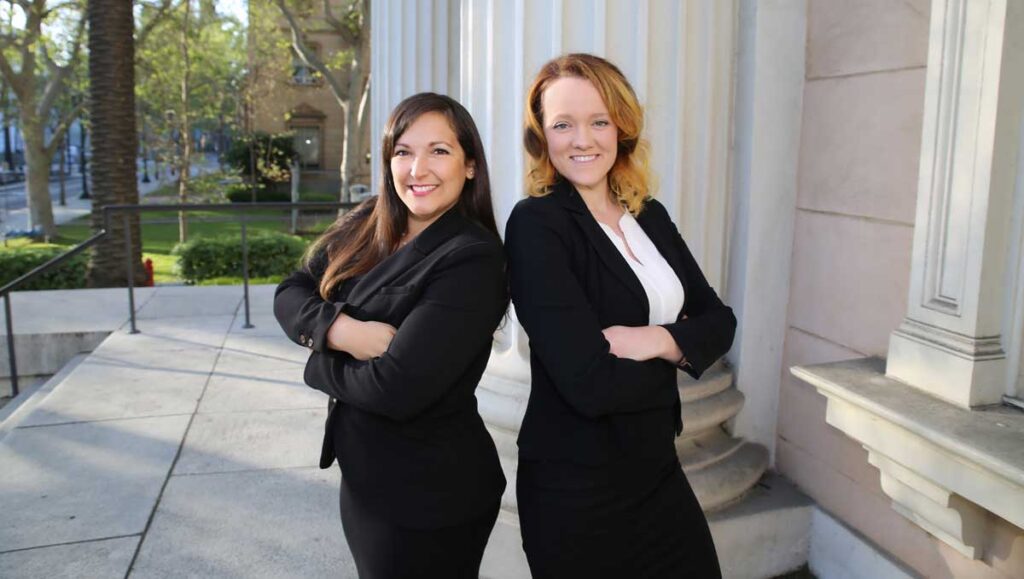 NatalieLauren-compressed Natalie Gomez and Lauren Edwards standing on the courthouse steps.